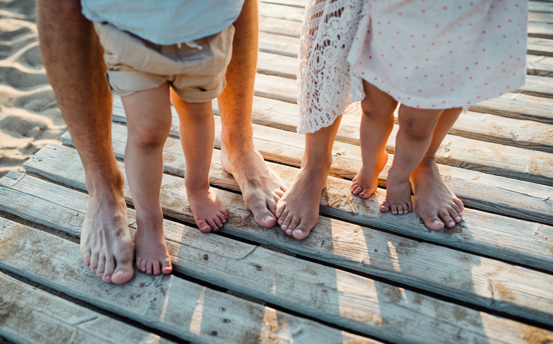 family standing on dock together