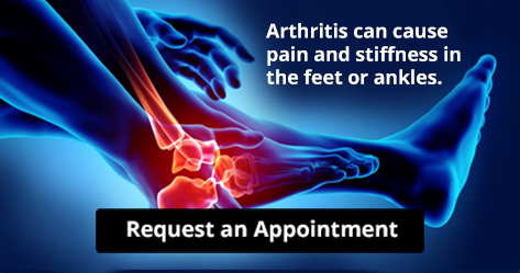 person holding their foot indicating pain or discomfort